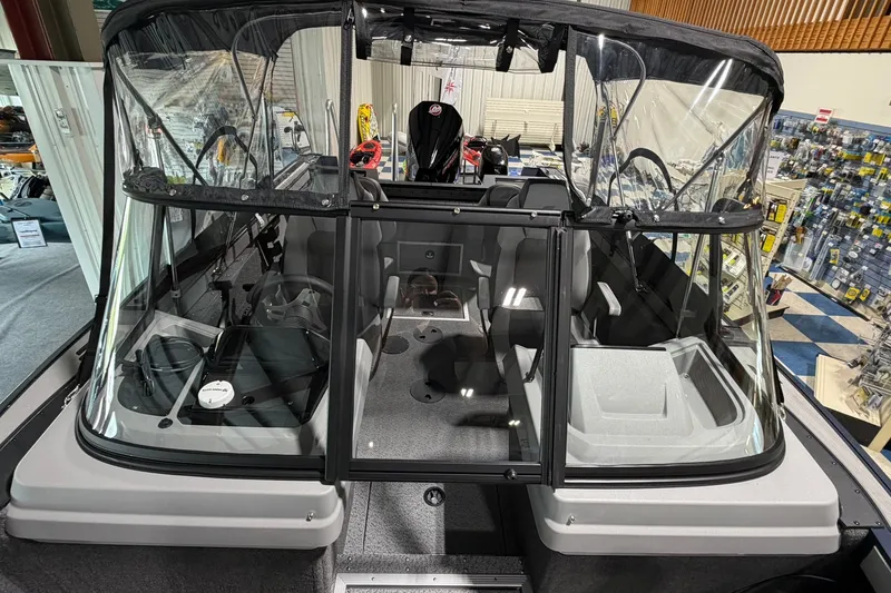 Slide: The Image of 2027 Starcraft Fishmaster 196 boat interior with windshield and seating. - 15