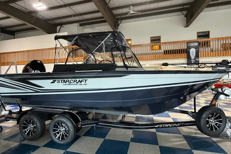 The Image of 2027 Starcraft Fishmaster 196 boat displayed indoors on a trailer. - 0