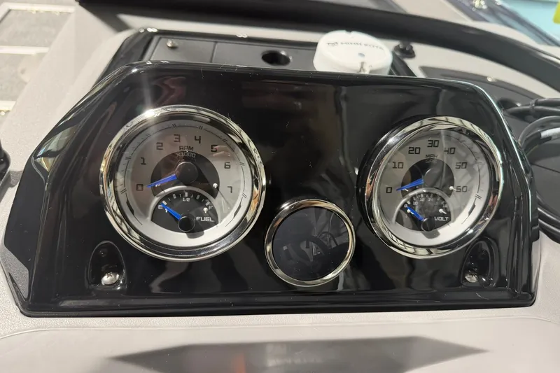 Slide: The Image of Dashboard of 2027 Starcraft Fishmaster 196 with RPM and speed gauges. - 7
