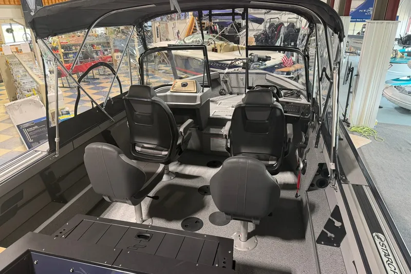 Slide: The Image of Interior view of 2027 Starcraft Fishmaster 196 boat with seating and dashboard. - 4
