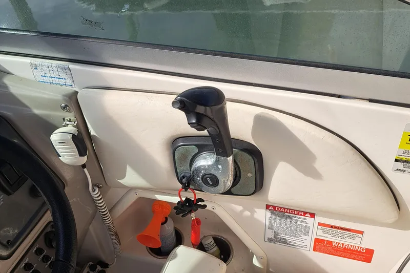 Slide: The Image of Close-up of 2007 Monterey 250 Cruiser boat controls and dashboard. - 12