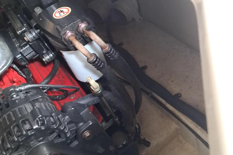 Slide: The Image of Engine compartment of a 2007 Monterey 250 Cruiser boat, showing mechanical components. - 5