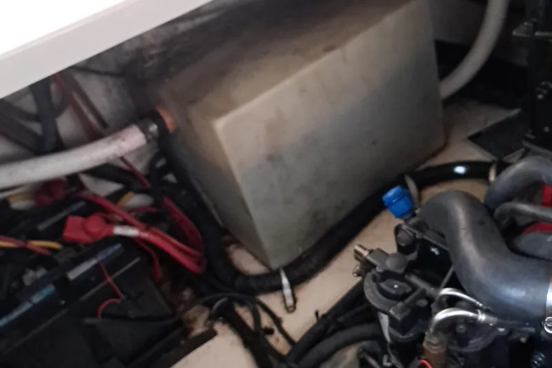 Slide: The Image of Engine compartment of a 2007 Monterey 250 Cruiser boat, showing various components and wiring. - 6
