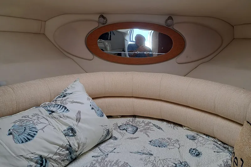 Slide: The Image of Interior of 2007 Monterey 250 Cruiser with cozy seating and decorative pillows. - 9