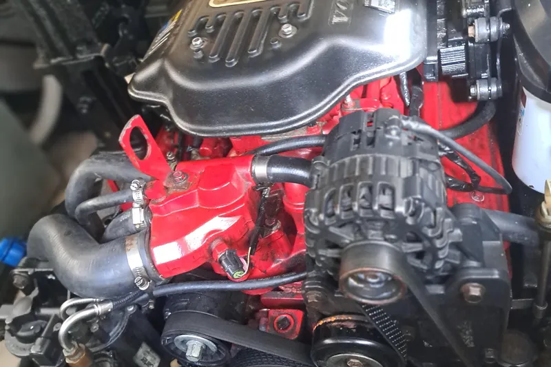 Slide: The Image of Close-up of a 2007 Monterey 250 Cruiser engine, showcasing red and black components. - 7