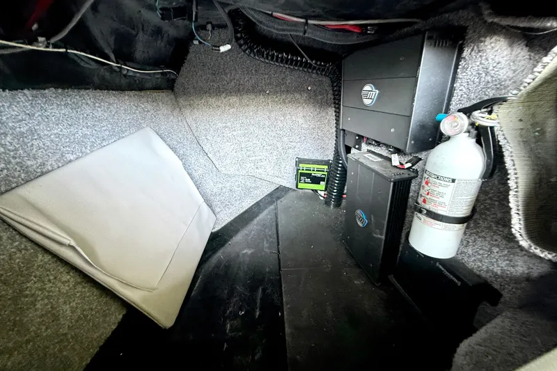 Slide: The Image of 2018 Malibu Wakesetter 21 MLX interior showing equipment and fire extinguisher. - 30