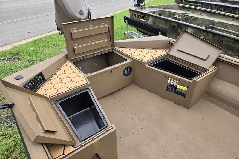 Slide: The Image of 2027 Havoc 1656 MRST MACH 1 boat interior with storage compartments and hexagonal design. - 11