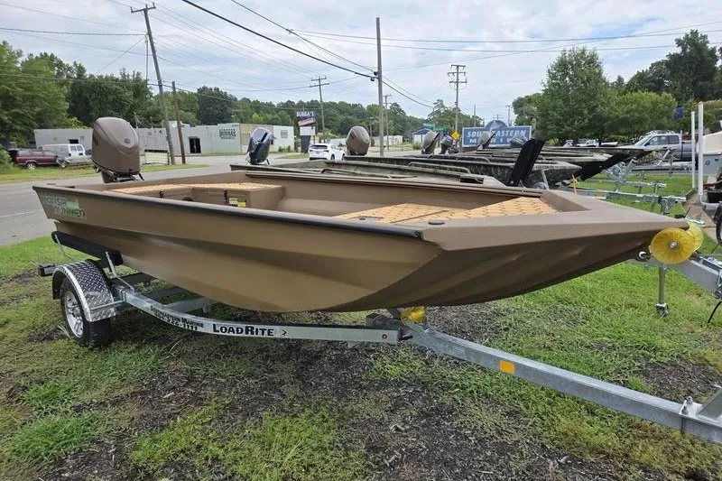 Slide: The Image of 2027 Havoc 1656 MRST MACH 1 boat on LoadRite trailer, parked outdoors. - 8