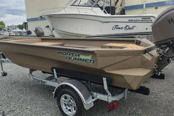 Slide: The Image of 2027 Havoc 1656 MRST MACH 1 Marsh Runner boat on trailer, parked outdoors. - 1
