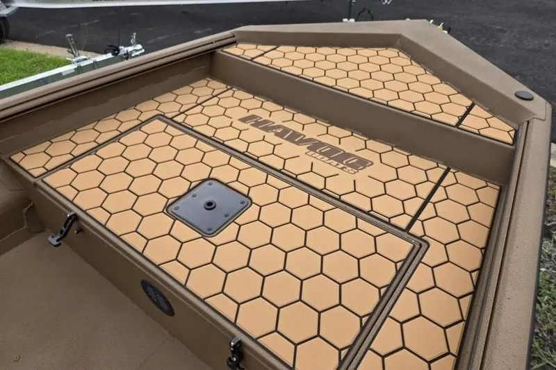 Slide: The Image of 2027 Havoc 1656 MRST MACH 1 boat deck with hexagonal pattern and logo. - 5
