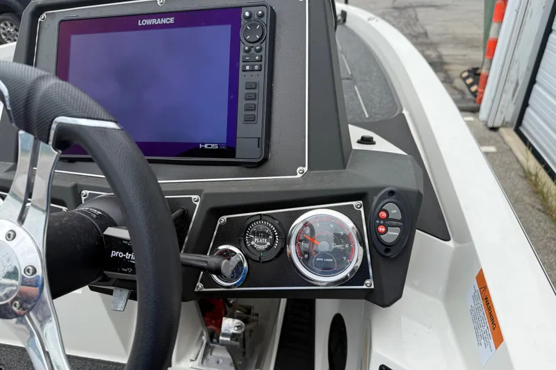 Slide: The Image of Dashboard of a 2022 Ranger Z519 boat with Lowrance HDS display and controls. - 19