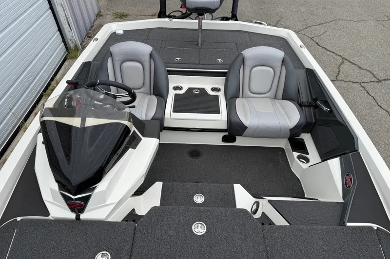 Slide: The Image of 2022 Ranger Z519 boat interior with dual seats and steering console. - 15