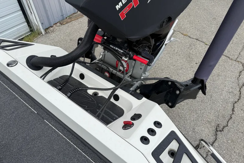 Slide: The Image of 2022 Ranger Z519 boat engine and control panel close-up. - 22