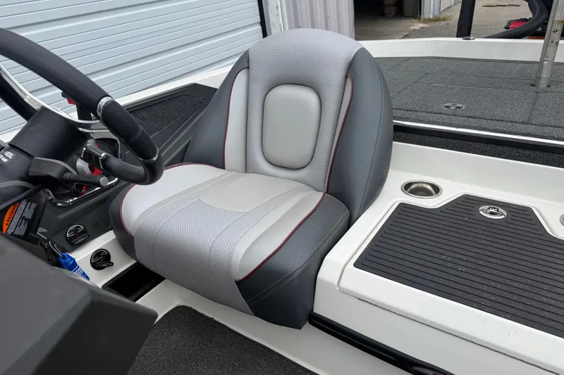 Slide: The Image of 2022 Ranger Z519 boat interior with gray seat and steering wheel. - 17