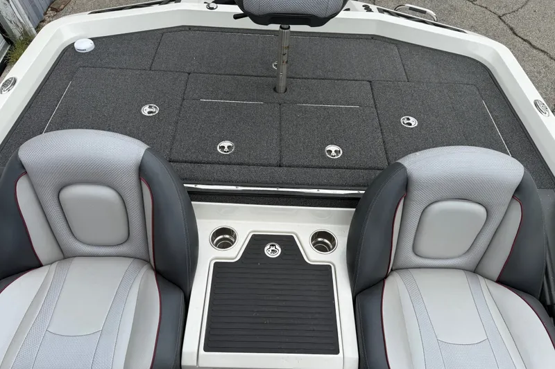 Slide: The Image of 2022 Ranger Z519 boat interior with gray seating and storage compartments. - 21
