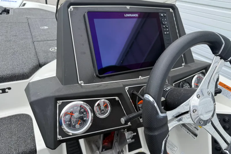 Slide: The Image of 2022 Ranger Z519 boat dashboard with Lowrance display and steering wheel. - 18