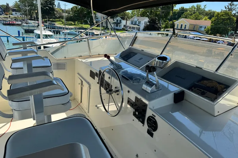 Slide: The Image of Cockpit of 1986 Hatteras 63 Cockpit Motor Yacht with steering wheel and controls. - 64