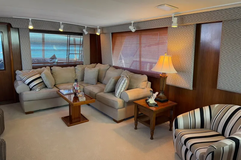 Slide: The Image of Luxurious interior of 1986 Hatteras 63 Cockpit Motor Yacht with elegant seating and decor. - 9