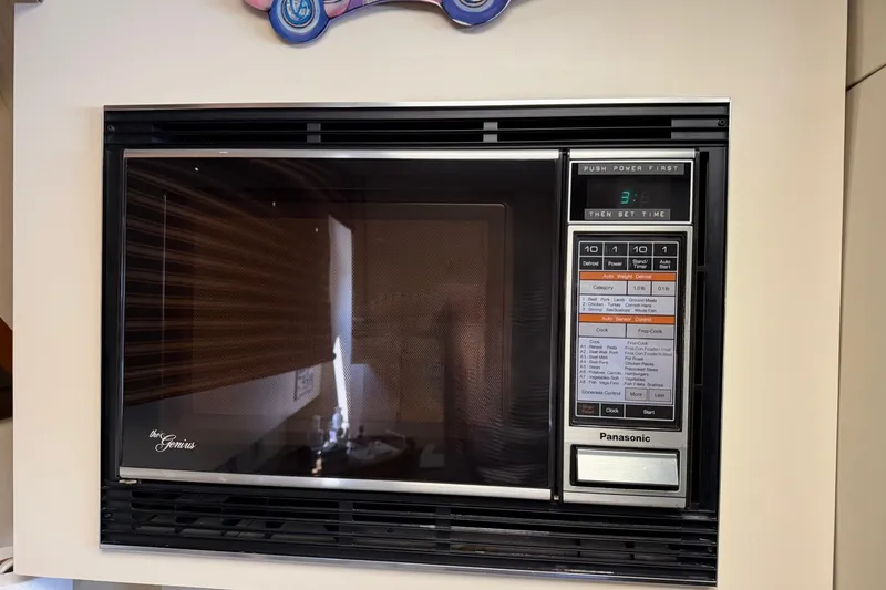 Slide: The Image of Panasonic microwave oven with digital controls, installed in a 1986 Hatteras 63 Cockpit Motor Yacht. - 30