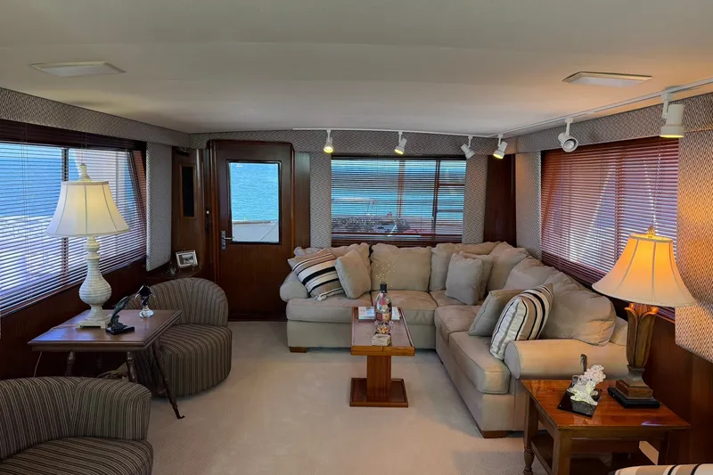 Slide: The Image of Luxurious interior of 1986 Hatteras 63 Cockpit Motor Yacht with elegant seating and decor. - 10