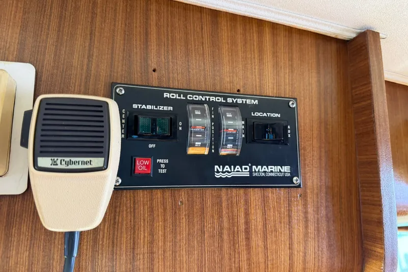 Slide: The Image of Control panel of 1986 Hatteras 63 Cockpit Motor Yacht with Naiad Marine stabilizer system. - 21