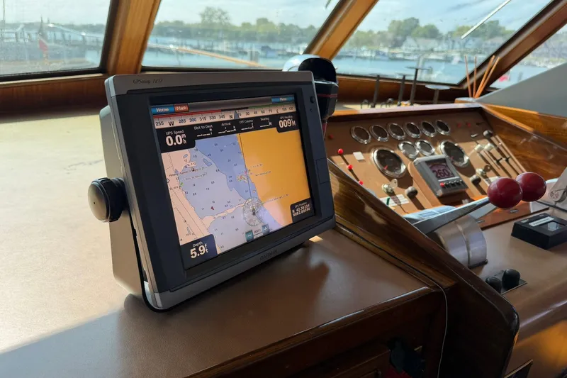 Slide: The Image of Cockpit of 1986 Hatteras 63 Yacht with navigation system and control panel. - 18