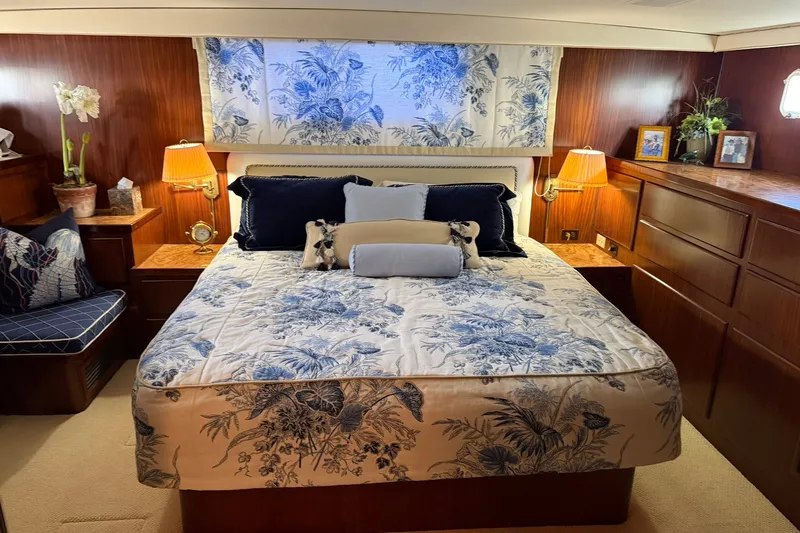Slide: The Image of Luxurious bedroom interior of 1986 Hatteras 63 Cockpit Motor Yacht with floral decor. - 43