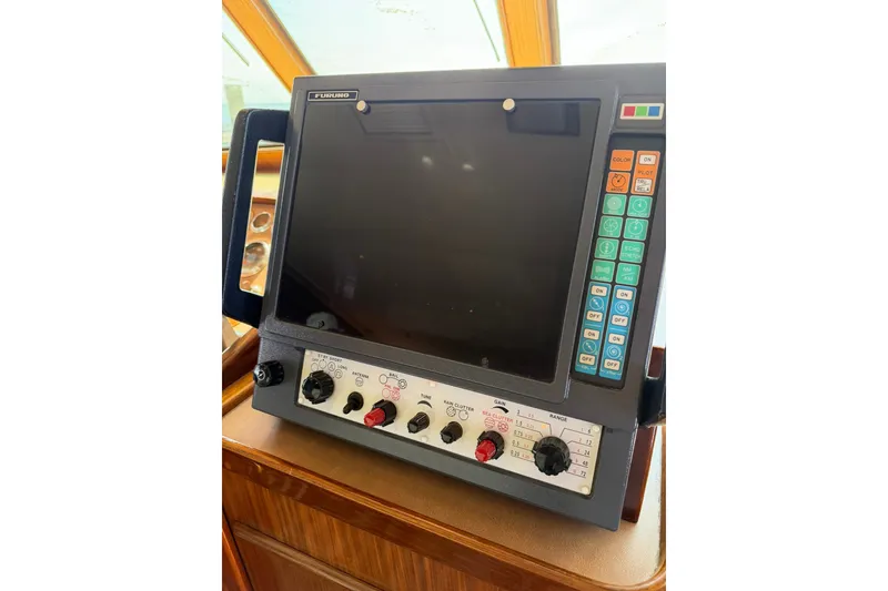 Slide: The Image of Furuno marine radar system on 1986 Hatteras 63 Cockpit Motor Yacht dashboard. - 19