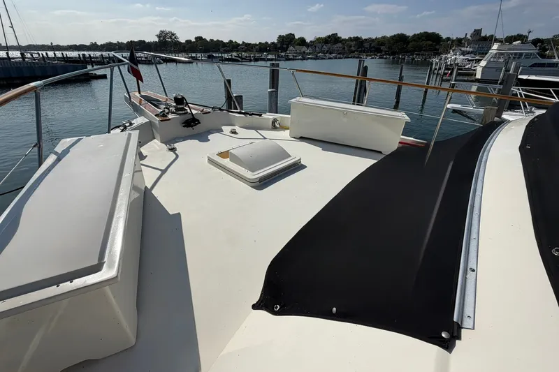 Slide: The Image of 1986 Hatteras 63 Cockpit Motor Yacht deck view at marina. - 6