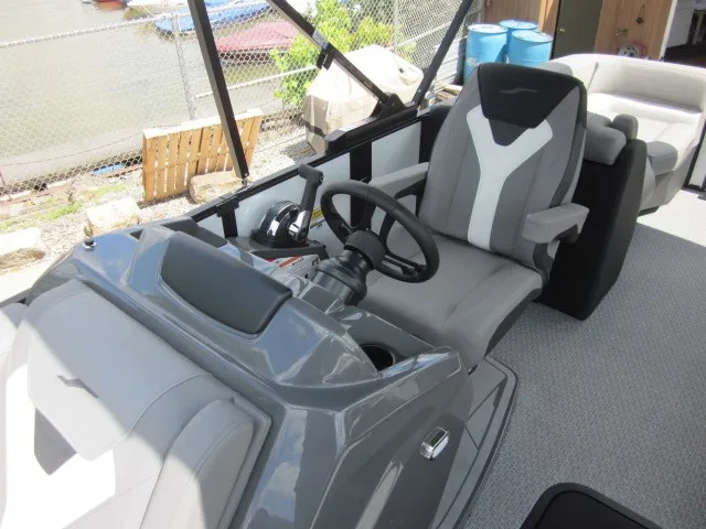 Slide: The Image of The image shows the cockpit of a 2027 Evotti 521 QL with a gray steering wheel and seats. - 14