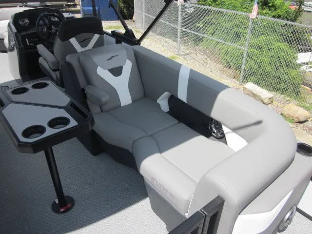 Slide: The Image of The image shows the cockpit of a 2027 Evotti 521 QL with gray upholstered seating and a table. - 24