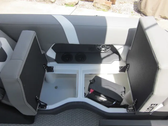 Slide: The Image of The image shows the interior of a 2027 Evotti 521 QL boat with gray seating and storage space. - 25