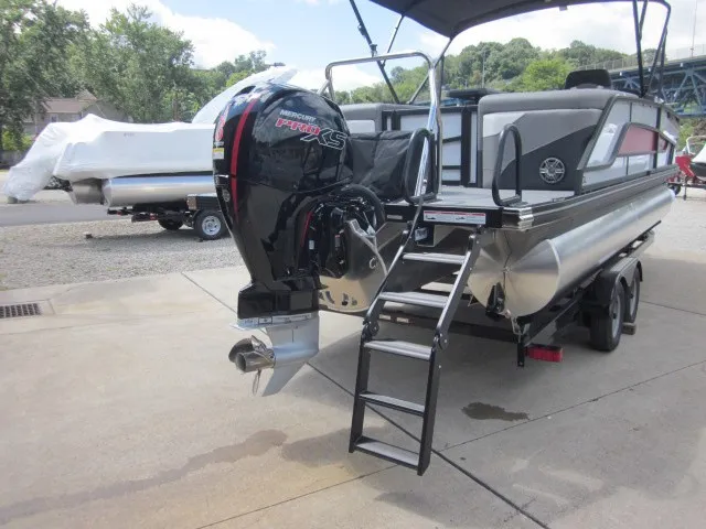 Slide: The Image of A 2027 Evotti 521 QL pontoon boat with a powerful outboard motor and a ladder at the stern. - 29