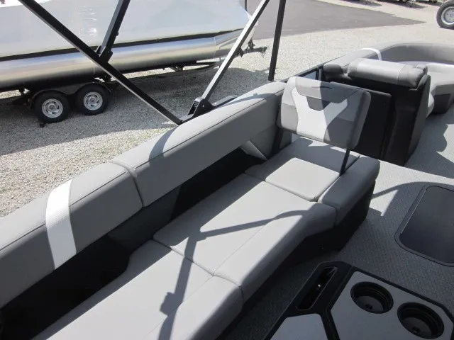 Slide: The Image of The image shows the gray seating of a 2027 Evotti 521 QL with cup holders. - 18
