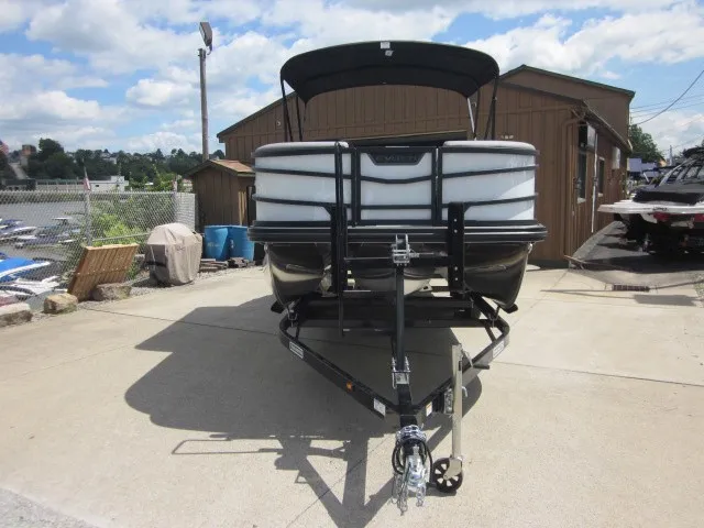 Slide: The Image of A 2027 Evotti 521 QL pontoon boat on a trailer in front of a building. - 8