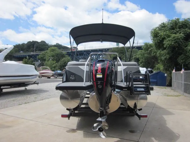 Slide: The Image of A 2027 Evotti 521 QL on a trailer, featuring a large outboard motor and sun canopy. - 5