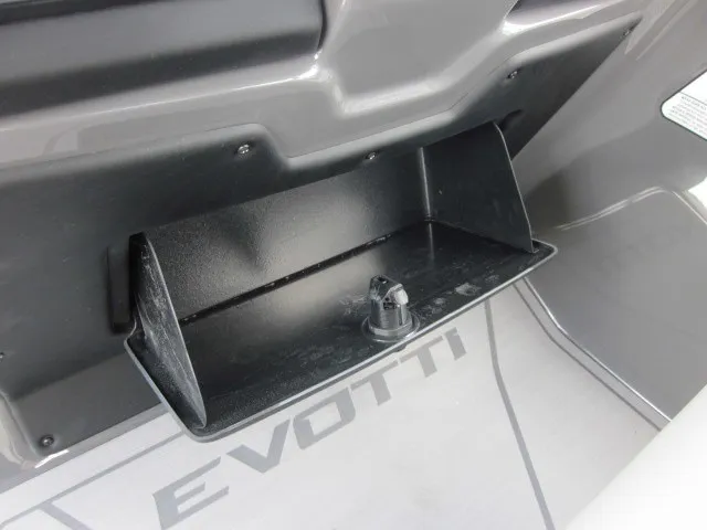 Slide: The Image of Close-up of a black storage compartment on a gray boat with "EVOTTI" lettering. - 16