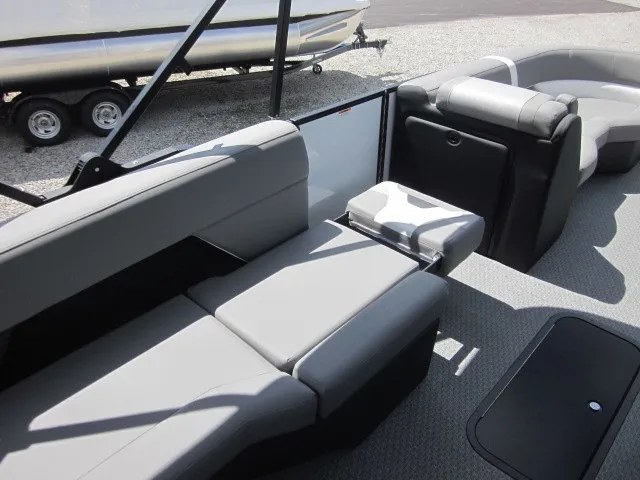 Slide: The Image of The image shows the interior of a 2027 Evotti 521 QL boat with gray upholstered seating. - 19