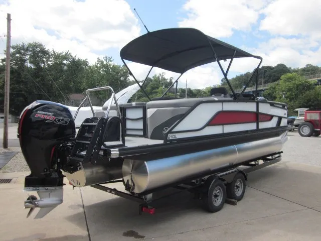 Slide: The Image of A modern pontoon boat with a black sunshade and powerful outboard motor on a trailer. - 6