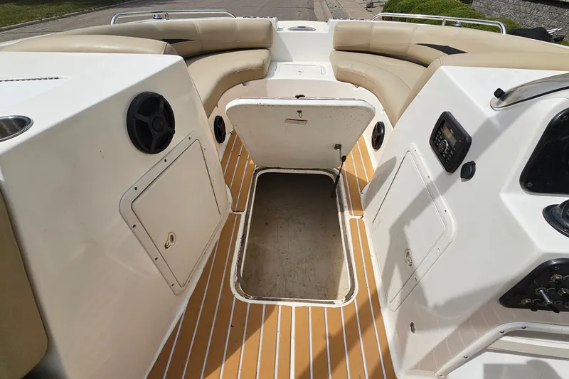 Slide: The Image of 2017 Hurricane SunDeck Sport 188 OB interior with seating and storage compartments. - 17