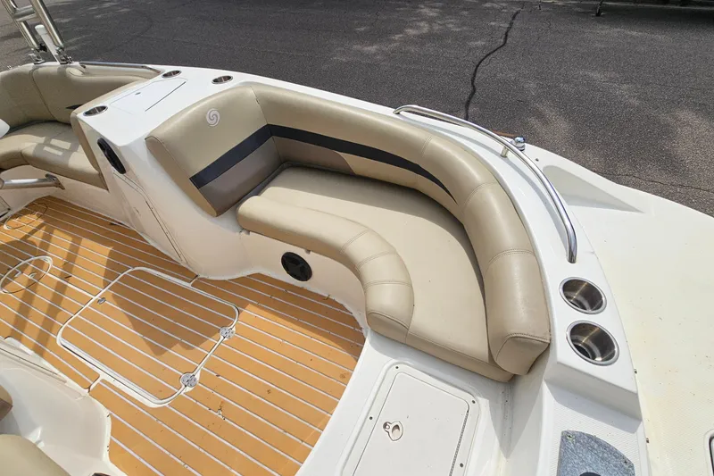 Slide: The Image of 2017 Hurricane SunDeck Sport 188 OB boat interior with beige seating and cup holders. - 15