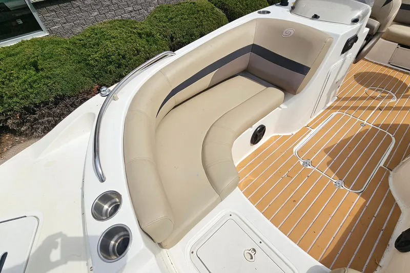 Slide: The Image of 2017 Hurricane SunDeck Sport 188 OB boat interior with beige seating and wood-patterned flooring. - 14