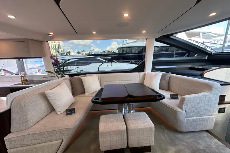 Slide: The Image of Luxurious interior of 2026 Fairline Squadron 58 yacht with elegant seating and modern design. - 19