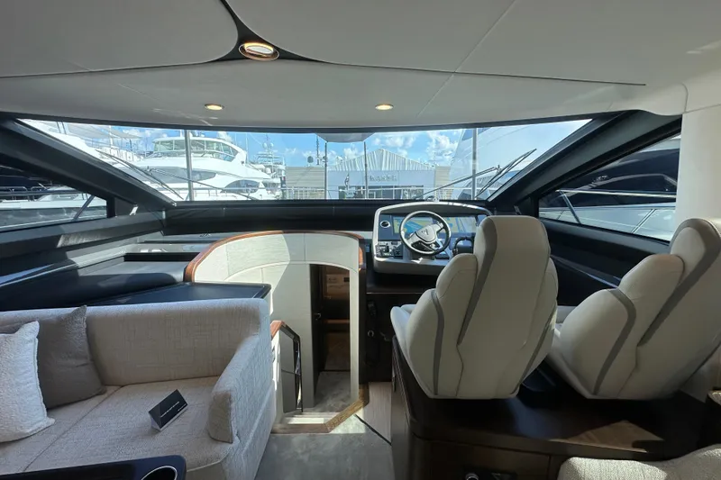 Slide: The Image of Luxurious interior of 2026 Fairline Squadron 58 yacht with modern helm and seating. - 21