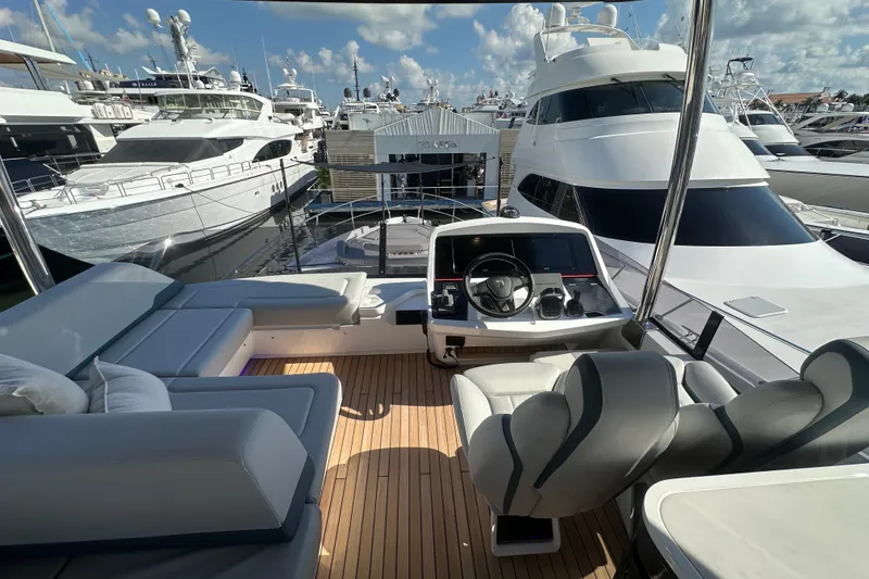 Slide: The Image of Luxury yacht Fairline Squadron 58, 2026 model, docked with spacious deck and modern helm. - 50