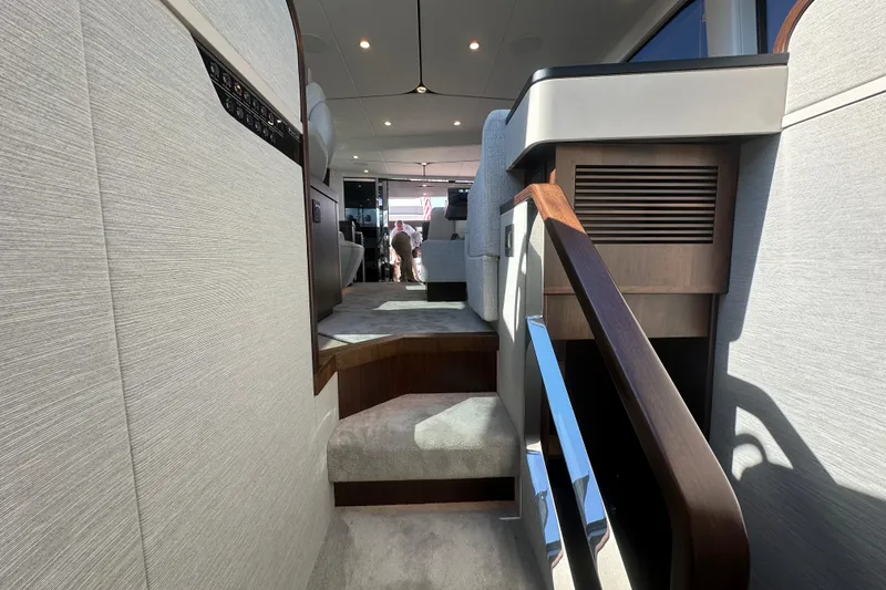 Slide: The Image of Interior view of 2026 Fairline Squadron 58 yacht, featuring modern design and elegant staircase. - 45