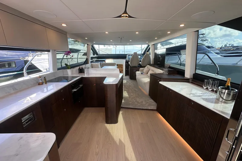 Slide: The Image of Luxurious interior of 2026 Fairline Squadron 58 yacht with modern kitchen and seating area. - 15