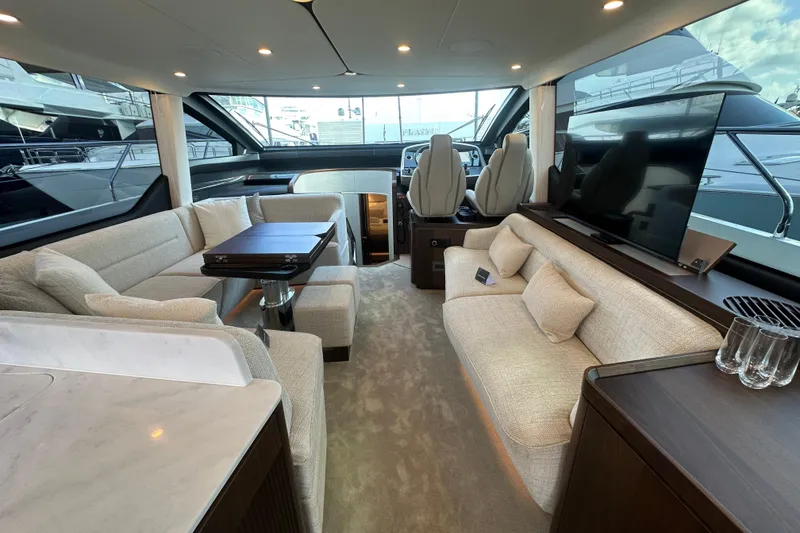 Slide: The Image of Luxurious interior of 2026 Fairline Squadron 58 yacht with elegant seating and modern amenities. - 18