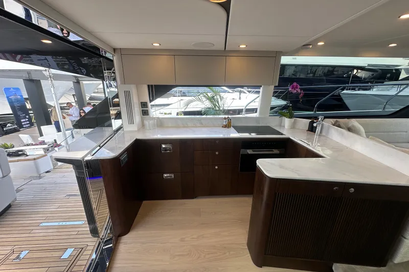 Slide: The Image of Luxurious interior of 2026 Fairline Squadron 58 yacht with modern kitchen design. - 17
