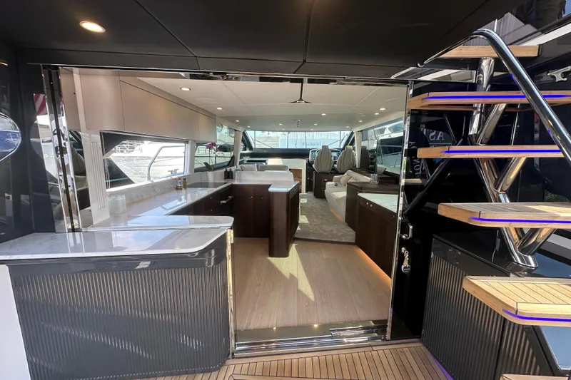 Slide: The Image of Luxurious interior of 2026 Fairline Squadron 58 yacht with modern design and elegant staircase. - 14
